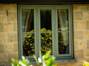 Side hung window with dummy sashes