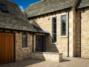 Cotswold Stone House with Aluminium clad Front door