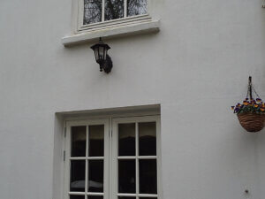 Rendered timber windows with glazing bars