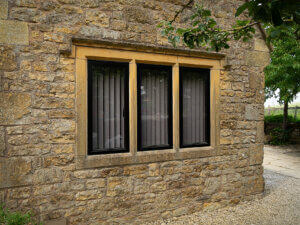 Black aluminium windows in Cotswold stone home
