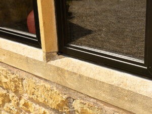 Heritage Aluminium windows fitted with central stone mullion