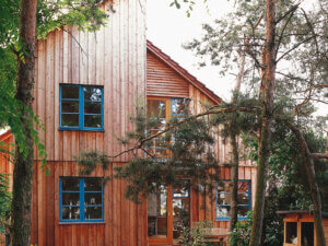 Timber home with Vrogum Rosenholm Side Hung Windows in Blue