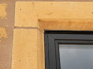 close fit Heritage windows with chamfered stone mullions