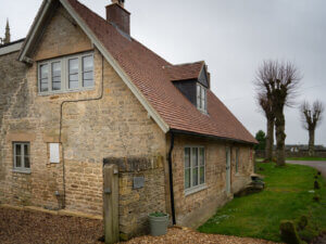 Cotswold home with grey windows and glazing bars