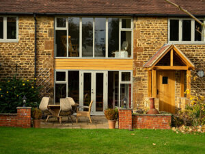 Cotswold stone home with RAL 7032 Pebble Grey windows