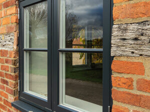 Rationel FormaPlus double side hung window with glazing bars RAL 7016 external RAL 9003 internal