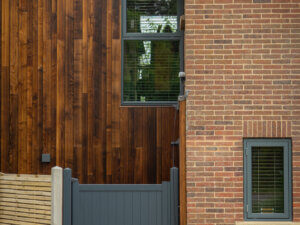 Topguided and side hung windows in a red Brick home