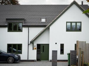 Olive Green Aluminium clad windows and doors in white render