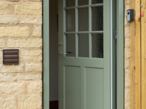 RAL 7033 Cement Grey Door in cotswold stone house