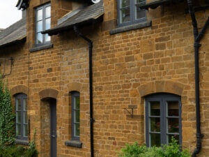 Rationel Formaplus windows Cotswold stone home with horizontal glazing bars