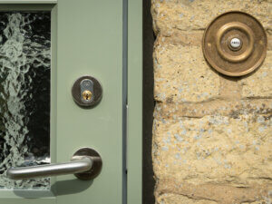 Rationel entrance door with handle and lock on a rose
