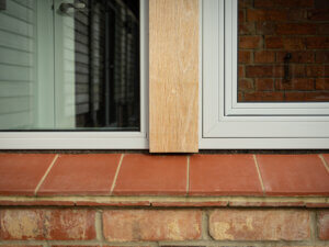 tile cill inder tilt turn and fixed windows with oak clad posts