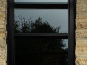 Alitherm heritage window with a PPC Black finish and an arched head