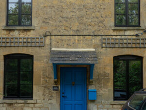 Unik Funkis Aluminium clad Entrance door in RAL 5015 Sky Blue with Black Alitherm heritage windows
