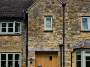 RAL 7032 Aluminium clad timber windows in a cotswold home