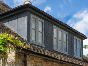 RAL 7032 Pebble Grey dormer windows with lead surround