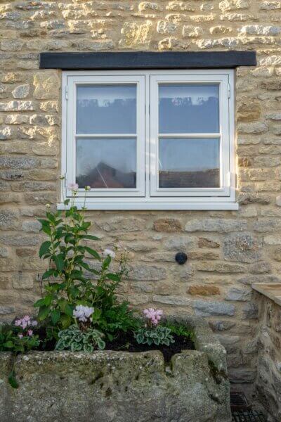 Double sidehung windows in a cotswold stone home